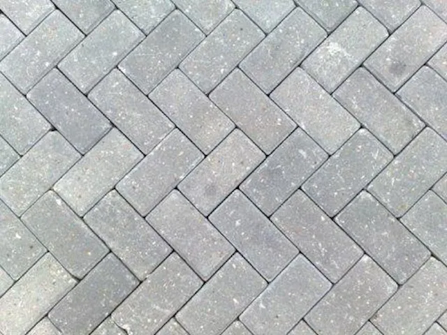 Herringbone pattern grey block paving for a residential driveway