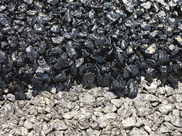 Close-up of Stone Mastic Asphalt aggregate material and dark bituminous mix